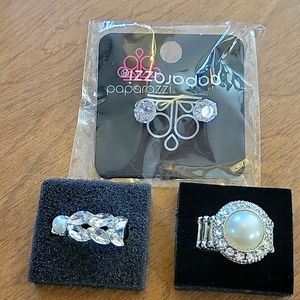 2 rings and a set of earrings